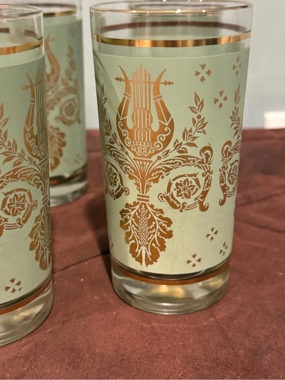 Set of 6 glasses vintage green and gold design. Holds 8 ounces